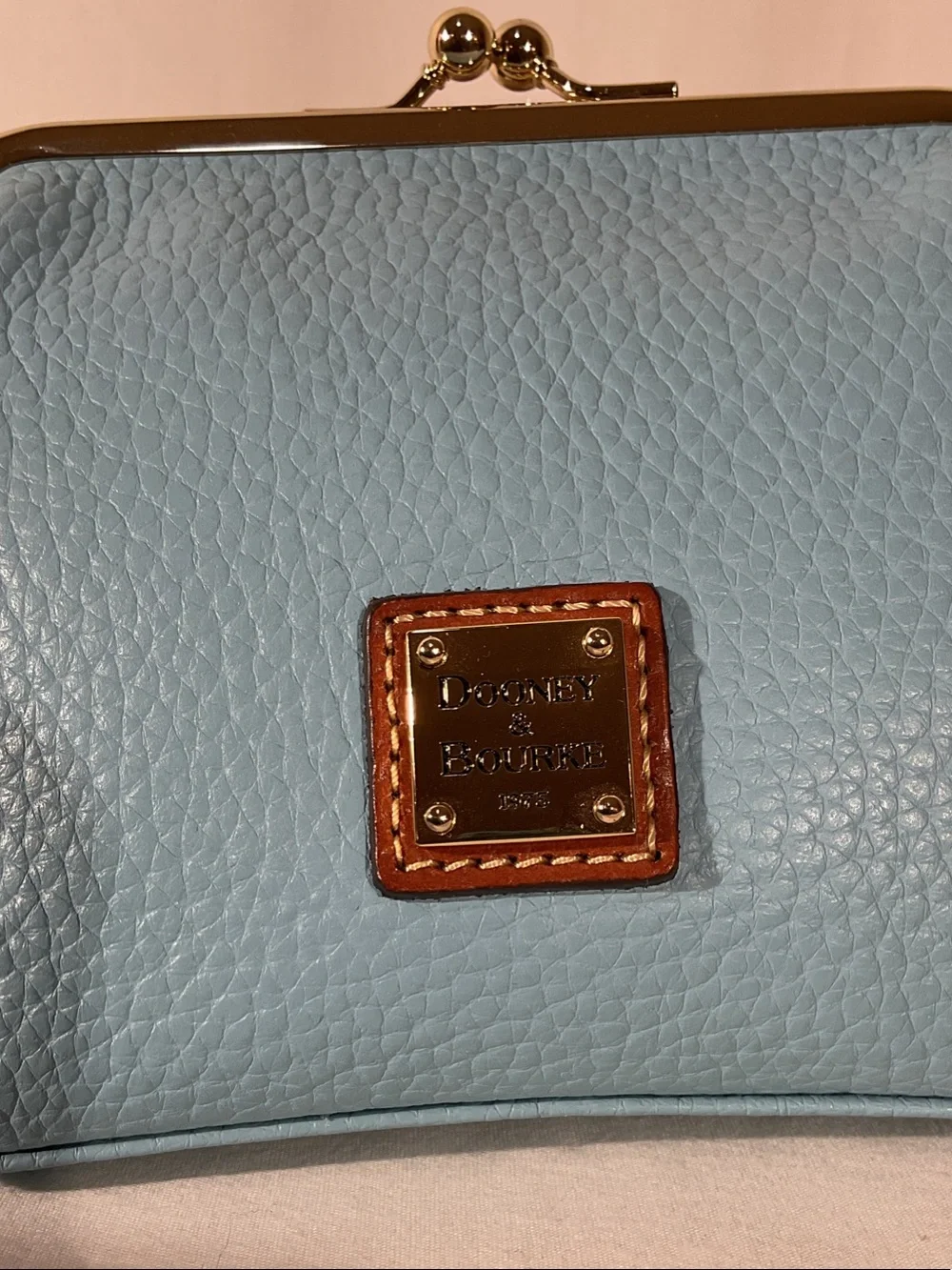 Dooney & Bourke Sky Blue Kiss- Pebble Leather large frame coin Purse.